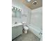 Well-lit bathroom with a vanity, mirror, and bath at 5604 Larimer Dr, Tampa, FL 33615