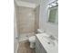 Modern bathroom features updated shower with tile surround, vanity, and fixtures at 5604 Larimer Dr, Tampa, FL 33615