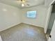 Bright bedroom featuring a ceiling fan and natural light from the window at 5604 Larimer Dr, Tampa, FL 33615