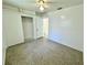 Bedroom featuring a ceiling fan and spacious closet at 5604 Larimer Dr, Tampa, FL 33615