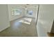Light-filled living room with neutral paint and tile flooring and large windows at 5604 Larimer Dr, Tampa, FL 33615