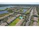 Aerial view showcases the community with lakes and well-maintained landscaping at 10106 Bessemer Pond Ct, Riverview, FL 33578