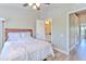 Bright bedroom features an en-suite bathroom, natural light, and relaxing atmosphere at 10106 Bessemer Pond Ct, Riverview, FL 33578