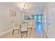 Cozy dining area with contemporary chandelier and open access to the backyard patio at 10106 Bessemer Pond Ct, Riverview, FL 33578