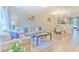 Inviting living room with lots of natural light and open floor plan to the dining area at 10106 Bessemer Pond Ct, Riverview, FL 33578