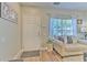 Inviting living room showcases a comfortable sofa and natural light from the window at 10106 Bessemer Pond Ct, Riverview, FL 33578