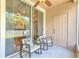 Covered patio with comfortable seating and a sliding glass door at 10106 Bessemer Pond Ct, Riverview, FL 33578