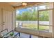 Screened-in patio with seating overlooks the backyard at 10106 Bessemer Pond Ct, Riverview, FL 33578