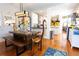 Cozy dining area adjacent to the kitchen features wood table and bench at 1036 23Rd N Ave, St Petersburg, FL 33704
