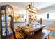 Dining area with a wooden table, bench seating, and decorative glass accents at 1036 23Rd N Ave, St Petersburg, FL 33704
