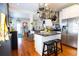 Modern kitchen with stainless steel appliances, center island, and hanging pot rack at 1036 23Rd N Ave, St Petersburg, FL 33704