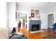 Cozy living room showcasing a painted brick fireplace with decorative mantle at 1036 23Rd N Ave, St Petersburg, FL 33704
