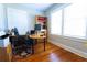 Well-lit home office with hardwood floors and large windows for a productive workspace at 1036 23Rd N Ave, St Petersburg, FL 33704