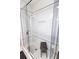 Stylish walk-in shower with white subway tile, a built-in niche, and a modern glass enclosure at 1036 23Rd N Ave, St Petersburg, FL 33704