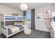 Charming bedroom featuring bunk beds and views of the lake at 10537 Longmeadow Ave, Parrish, FL 34219
