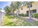 Spacious backyard featuring lush green grass and mature trees, offering privacy at 10928 Brickside Ct, Riverview, FL 33579
