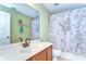 Bathroom featuring a white vanity, a decorative shower curtain, and a neutral color scheme at 10928 Brickside Ct, Riverview, FL 33579