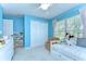 bedroom featuring bright blue walls, carpeted floors, and a closet at 10928 Brickside Ct, Riverview, FL 33579