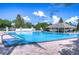 Community pool with a large deck, plenty of seating and covered lounge area at 10928 Brickside Ct, Riverview, FL 33579