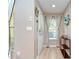 Welcoming entryway with wood-look flooring, stylish decor, and ample natural light at 10928 Brickside Ct, Riverview, FL 33579