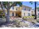 Charming two-story townhome with well-manicured landscaping and inviting walkway at 10928 Brickside Ct, Riverview, FL 33579
