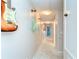 Hallway featuring a guitar display and neutral color scheme at 10928 Brickside Ct, Riverview, FL 33579