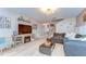 Inviting living room with fireplace, modern lighting, and open layout at 10928 Brickside Ct, Riverview, FL 33579