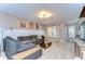Spacious living room with hardwood floors, modern decor, and a comfortable seating area at 10928 Brickside Ct, Riverview, FL 33579