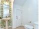Stylish powder room with unique wallpaper, pedestal sink, and contemporary fixtures at 10928 Brickside Ct, Riverview, FL 33579