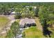 Aerial view showcasing the home's location on a sprawling lot with lush landscaping at 11165 Little Gull Rd, Weeki Wachee, FL 34614