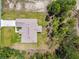 Bird's eye view of the home on a spacious lot with a long driveway and mature trees at 11165 Little Gull Rd, Weeki Wachee, FL 34614