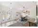 Bright dining room with modern light fixture and neutral decor at 11165 Little Gull Rd, Weeki Wachee, FL 34614