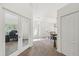 Inviting hallway showcasing an office with glass doors, dining room and tiled foyer at 11165 Little Gull Rd, Weeki Wachee, FL 34614