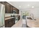Well-equipped kitchen with stainless steel appliances and a view to a covered patio at 11165 Little Gull Rd, Weeki Wachee, FL 34614