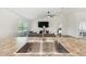 Kitchen stainless steel sink and view of living area with fan and entertainment center at 11165 Little Gull Rd, Weeki Wachee, FL 34614