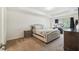 A main bedroom with carpet, a bed, a window and two nightstands at 11165 Little Gull Rd, Weeki Wachee, FL 34614