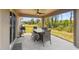 Covered patio with a dining set offers outdoor enjoyment and scenic views at 11165 Little Gull Rd, Weeki Wachee, FL 34614