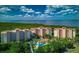 Breathtaking aerial view showcasing lush greenery, waterfront access, and beautiful condo buildings at 12033 Gandy N Blvd # 131, St Petersburg, FL 33702