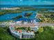 Panoramic aerial view of a building complex with marina access, surrounded by lush greenery at 12033 Gandy N Blvd # 131, St Petersburg, FL 33702