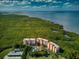 Amazing aerial view of the building complex, nestled between lush greenery and a stunning bay at 12033 Gandy N Blvd # 131, St Petersburg, FL 33702