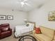 Bedroom featuring a seating area and a cozy bed at 12033 Gandy N Blvd # 131, St Petersburg, FL 33702