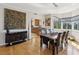 Dining area with hardwood floors, bay window, and stylish decor adjacent to the kitchen at 12033 Gandy N Blvd # 131, St Petersburg, FL 33702