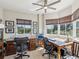 Bright home office featuring two work stations, neutral walls, and natural light from surrounding outdoor foliage at 12033 Gandy N Blvd # 131, St Petersburg, FL 33702