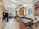 Open kitchen with breakfast bar, stainless steel appliances, and natural light at 12033 Gandy N Blvd # 131, St Petersburg, FL 33702