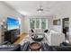 Comfortable living room featuring hardwood floors, large windows, and modern decor at 12033 Gandy N Blvd # 131, St Petersburg, FL 33702