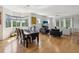 Bright open-concept living area with hardwood floors, large windows, and comfortable seating at 12033 Gandy N Blvd # 131, St Petersburg, FL 33702