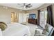 The main bedroom features balcony access, a king bed, and an en-suite bathroom at 12033 Gandy N Blvd # 131, St Petersburg, FL 33702