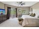 Spacious main bedroom boasts balcony access, neutral tones, and a plush king bed with decorative pillows at 12033 Gandy N Blvd # 131, St Petersburg, FL 33702