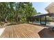 Large backyard with a pool and a spacious deck for outdoor activities and entertaining at 12503 Bronco Dr, Tampa, FL 33626