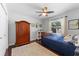 Bright bedroom with a ceiling fan, and a large window that lets in natural light at 12503 Bronco Dr, Tampa, FL 33626